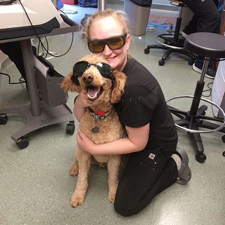 vet with glasses with dog with glasses